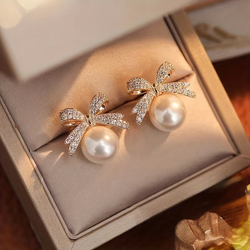 Nœud Chic | Modieuze Strikvormige Faux Parel Oorbellen | Stijlvol Design - Ideaal Voor Dames Met Een Unieke Twist